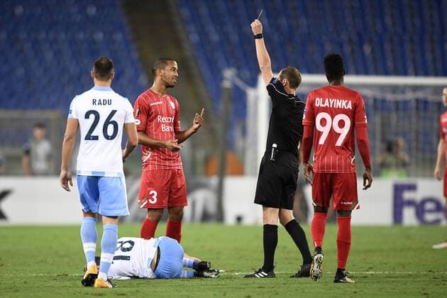 Essevee s Marvin Baudry receives a yellow card from Swiss referee Harald Lechner during a soccer game between Italian club Societa Sportiva Lazio and Belgian team SV Zulte Waregem, in Roma, Italy, Thursday 28 September 2017, the second game of the group stage (Group K) of the UEFA Europa League competition. YORICKxJANSENS  x05174217x