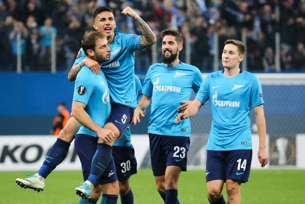 ST PETERSBURG, RUSSIA - SEPTEMBER 28, 2017: FC Zenit St Petersburg s Branislav Ivanovic, Leandro Paredes, Miha Mevlja, and Daler Kuzyayev (L-R) celebrate scoring in their 2017-18 UEFA Europa League Group L Round 2 football match against FC Real Sociedad at Saint Petersburg Stadium. Alexander Demianchuk TASS  TS0624FA