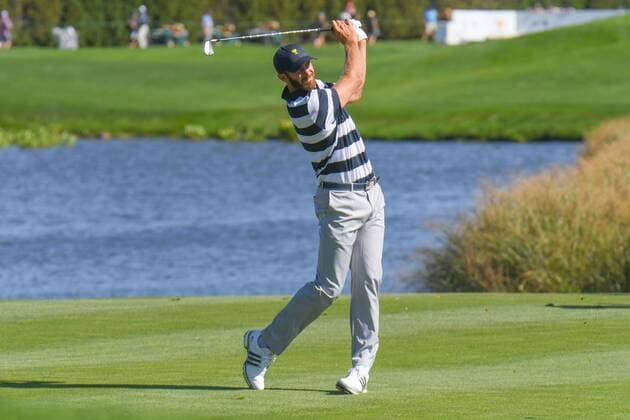 Thursday September 28, 2017: Dustin Johnson of the United States watches his shot on the 5th hole during the opening round of the Presidents Cup at Liberty National Golf Course in Jersey City, New Jersey. CSM PGA Golf Herren 2017: Presidents Cup SEPT 28 - ZUMAc04_ 20170928_zaf_c04_007 Copyright: xGregoryxVasilx