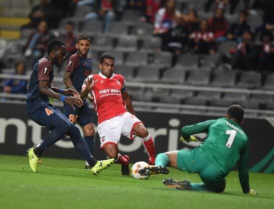 (170929) -- BRAGA, Sept. 29, 2017 -- Istanbul s Volkan Babacan (R) vies with Braga s Marcelo Goiano (C) during the UEFA Europa League soccer match between SC Braga and Istanbul Basaksehir in Braga, Portugal, on Sept. 28, 2017. Braga won 2-1. ) (SP)PORTUGAL-BRAGA-UEFA-EUROPA LEAGUE ZhangxLiyun 