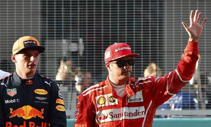 (170930) -- SEPANG, Sept. 30, 2017 -- Ferrari s Kimi Raikkonen (R) of Finland waves to spectators after the qualifying session at the Formula One Malaysia Grand Prix at the Sepang Circuit in Malaysia, on Sept. 30, 2017. ) (SP)MALAYSIA-SEPANG-F1-QUALIFYING SESSION ChongxVoonxChung 