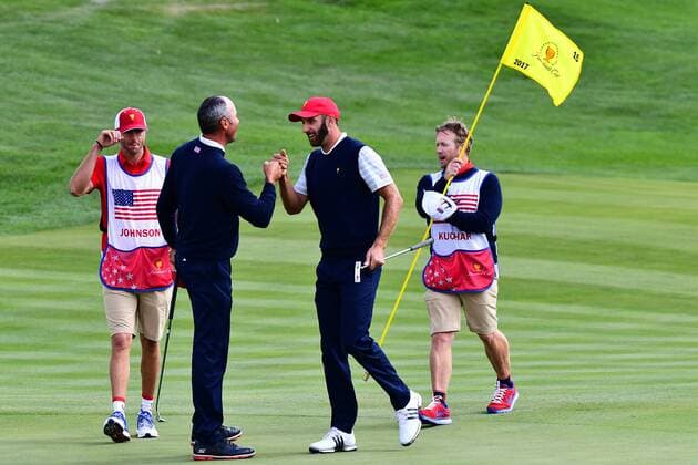 September 30, 2017 - Jersey City, New Jersey, U.S - Matt Kuchar of the US Team(left) and Dustin Johnson of the US Team(right) celebrate a team victory on the 15th hole during Saturday matches of the Presidents Cup at Liberty National Golf Club in Jersey City, NJ GOLF 2017 - Presidents Cup - ZUMAc119 20170930_zaf_c119_019 Copyright: xBrianxCianciox