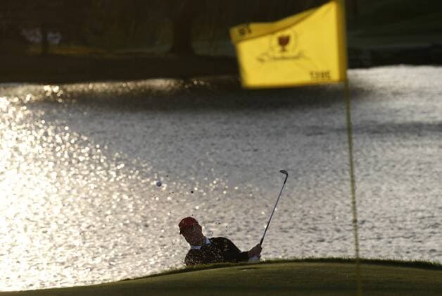 Charlie Hoffman from the United States hits from a green side bunker on the 18th hole in the afternoon four-ball matches at the Presidents Cup on September 30, 2017 at Liberty National Golf Club in Jersey City, New Jersey. The United States leads International team 14.5 to 3.5 at the end of the days play.  NYP20170930143 JOHNxANGELILLO
