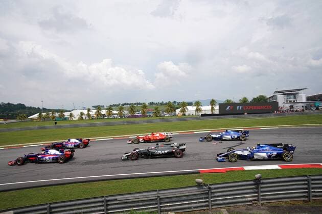 01.10.2017 - Race, Start of the race, Romain Grosjean (FRA) Haas F1 Team VF-17 and Sebastian Vettel (GER) Scuderia Ferrari SF70H Malaysian Grand Prix, Sepang 28 September - 1 October 2017 01.10.2017 - Race, Start of the race, Romain Grosjean (FRA) Haas F1 Team VF-17 and Sebastian Vettel (GER) Scuderia Ferrari SF70H 