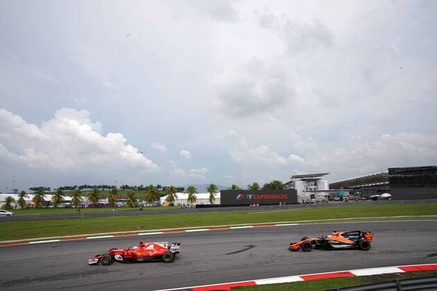 01.10.2017 - Race, Sebastian Vettel (GER) Scuderia Ferrari SF70H and Fernando Alonso (ESP) McLaren MCL32 Malaysian Grand Prix, Sepang 28 September - 1 October 2017 01.10.2017 - Race, Sebastian Vettel (GER) Scuderia Ferrari SF70H and Fernando Alonso (ESP) McLaren MCL32 