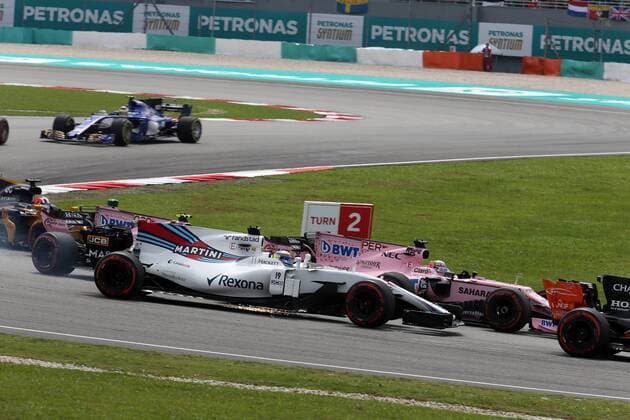 01.10.2017 - Race, Start of the race, Felipe Massa (BRA) Williams FW40 and Esteban Ocon (FRA) Sahara Force India F1 VJM10 Malaysian Grand Prix, Sepang 28 September - 1 October 2017 01.10.2017 - Race, Start of the race, Felipe Massa (BRA) Williams FW40 and Esteban Ocon (FRA) Sahara Force India F1 VJM10 