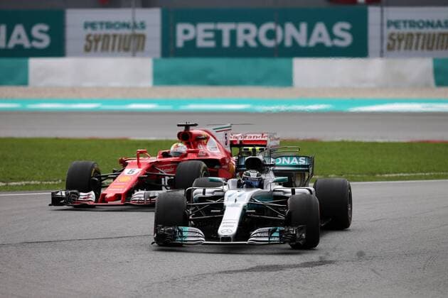 01.10.2017 - Race, Sebastian Vettel (GER) Scuderia Ferrari SF70H and Valtteri Bottas (FIN) Mercedes AMG F1 W08 Malaysian Grand Prix, Sepang 28 September - 1 October 2017 01.10.2017 - Race, Sebastian Vettel (GER) Scuderia Ferrari SF70H and Valtteri Bottas (FIN) Mercedes AMG F1 W08 