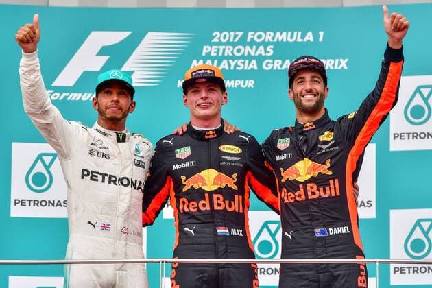 (171001) -- SEPANG, Oct. 1, 2017 -- Red Bull driver Max Verstappen (C) of the Netherlands, Mercedes driver Lewis Hamilton (L) of Britain and Red Bull driver Daniel Ricciardo of Australia pose for pictures on the podium after the Formula One Malaysia Grand Prix at the Sepang Circuit in Malaysia, on Oct. 1, 2017. Max Verstappen claimed the title of the event. ) (SP)MALAYSIA-SEPANG-F1 ChongxVoonxChung 