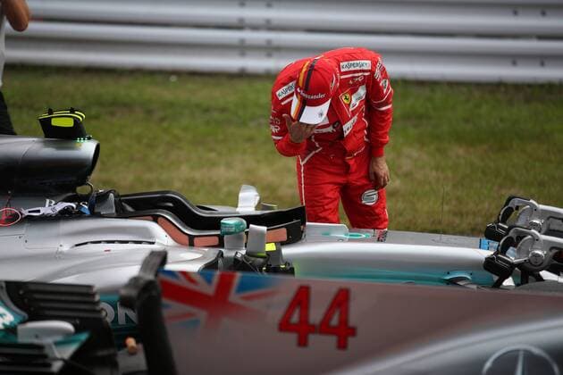 07.10.2017- After Qualifying celebration: Sebastian Vettel (GER) Scuderia Ferrari SF70H take a look to Mercedes AMG F1 W08 Japanese Grand Prix, Suzuka 05 - 08 October 2017 07.10.2017- After Qualifying celebration: Sebastian Vettel (GER) Scuderia Ferrari SF70H take a look to Mercedes AMG F1 W08 