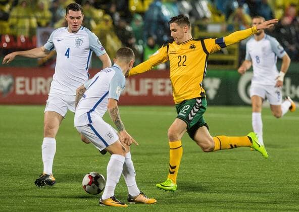 (171009) -- VILNIUS, Oct. 9, 2017 -- Fiodor Cernych (R) of Lithuania vies for the ball during the FIFA World Cup WM Weltmeisterschaft Fussball European Qualifying Group F match between Lithuania and England in Vilnius, Lithuania, on Oct. 8, 2017. England won 1-0. ) (SP)LITHUANIA-VILNIUS-WORLD CUP QUALIFIER-LITHUANIA VS ENGLAND AlfredasxPliadis 