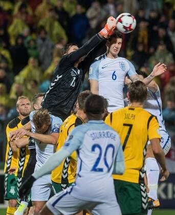 (171009) -- VILNIUS, Oct. 9, 2017 -- Lithuania s goalkeeper Ernestas Setkus (Top, L) saves the ball during the FIFA World Cup WM Weltmeisterschaft Fussball European Qualifying Group F match between Lithuania and England in Vilnius, Lithuania, on Oct. 8, 2017. England won 1-0. ) (SP)LITHUANIA-VILNIUS-WORLD CUP QUALIFIER-LITHUANIA VS ENGLAND AlfredasxPliadis 
