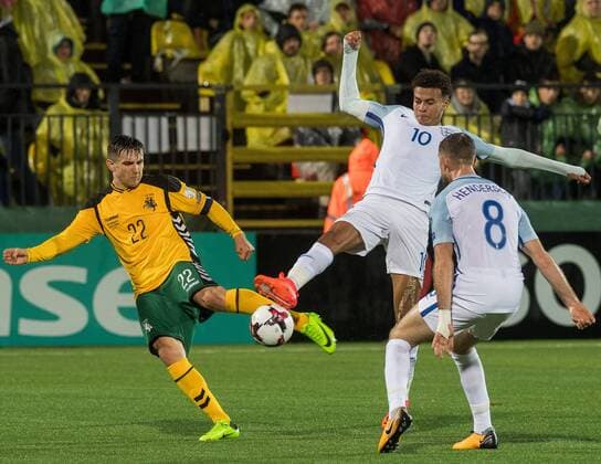 (171009) -- VILNIUS, Oct. 9, 2017 -- Fiodor Cernych (L) of Lithuania vies with Dele Alli (C) of England during the FIFA World Cup WM Weltmeisterschaft Fussball European Qualifying Group F match between Lithuania and England in Vilnius, Lithuania, on Oct. 8, 2017. England won 1-0. ) (SP)LITHUANIA-VILNIUS-WORLD CUP QUALIFIER-LITHUANIA VS ENGLAND AlfredasxPliadis 