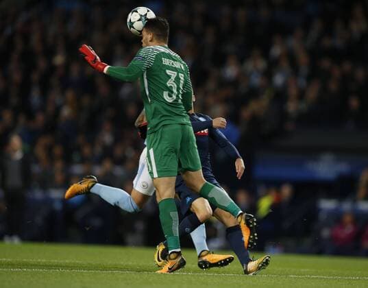 Ederson of Manchester City heads clear under pressure during the champions league match at the Etihad Stadium, Manchester. Picture date 17th October 2017. Picture credit should read: Simon Bellis Sportimage EDITORIAL USE ONLY. No use with unauthorised audio, video, data, fixture lists, club league logos or live services. Online in-match use limited to 120 images, no video emulation. No use in betting, games or single club league player publications.
