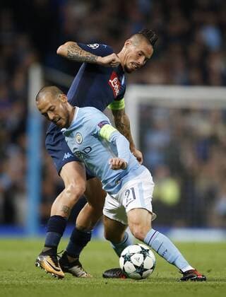 David Silva of Manchester City tussles with Marek Hamsik of Napoli during the champions league match at the Etihad Stadium, Manchester. Picture date 17th October 2017. Picture credit should read: Simon Bellis Sportimage EDITORIAL USE ONLY. No use with unauthorised audio, video, data, fixture lists, club league logos or live services. Online in-match use limited to 120 images, no video emulation. No use in betting, games or single club league player publications.