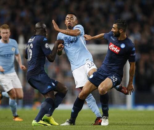 Gabriel Jesus of Manchester City is chopped down by Kalidou Koulibaly and Raul Albiol of Napoli during the champions league match at the Etihad Stadium, Manchester. Picture date 17th October 2017. Picture credit should read: Simon Bellis Sportimage EDITORIAL USE ONLY. No use with unauthorised audio, video, data, fixture lists, club league logos or live services. Online in-match use limited to 120 images, no video emulation. No use in betting, games or single club league player publications.