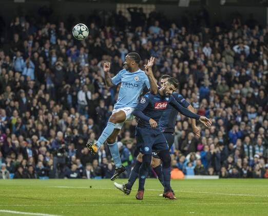 17th October 2017, Etihad Stadium, Manchester, England; UEFA Champions League, Manchester City versus Napoli; Raheem Sterling of Manchester City outjumps the Napoli defence to win the ball  ActionPlus11941154
