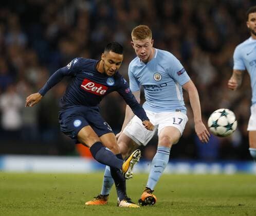 Raul Albiol of Napoli tussles with Kevin De Bruyne of Manchester City during the champions league match at the Etihad Stadium, Manchester. Picture date 17th October 2017. Picture credit should read: Simon Bellis Sportimage EDITORIAL USE ONLY. No use with unauthorised audio, video, data, fixture lists, club league logos or live services. Online in-match use limited to 120 images, no video emulation. No use in betting, games or single club league player publications.