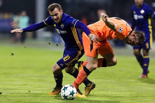17th October 2017, Ljudski vrt, Maribor, Slovenia; UEFA Champions League, NK Maribor versus Liverpool; Midfielder James Milner of Liverpool in action against Midfielder Dino Hotic of Maribor  ActionPlus11941164