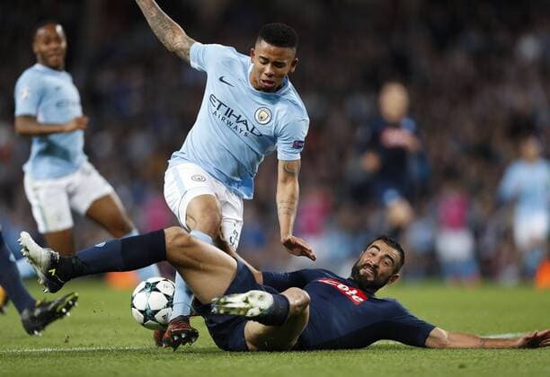 (171018) -- MANCHESTER, Oct. 18, 2017 -- Gabriel Jesus (top) of Manchester City is tackled during the UEFA Champions League Group F match between Manchester City and Napoli at Etihad Stadium, in Manchester, Britain on Oct. 17, 2017. Manchester City won 2-1. ) (SP)BRITAIN-MANCHESTER-SOCCER-UEFA CHAMPIONS LEAGUE-MANCHESTER CITY VS NAPOLI HanxYan 