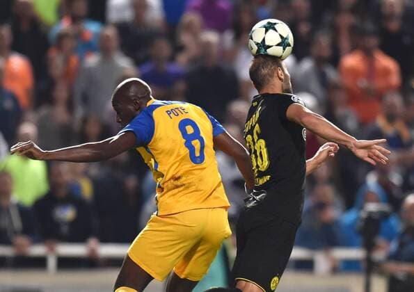 (171018) -- NICOSIA, Oct. 18, 2017 -- Apoel s Michael Pote (L) vies for the ball during the 2017-2018 Champions League match against Bortussia Dortmund in Nicosia, Cyprus, Oct. 17, 2017. The match tied 1-1. ) (SP)CYPRUS-NICOSIA-SOCCER-UEFA CHAMPIONS LEAGUE-BORTMUND VS APOEL SakisxSavvides 