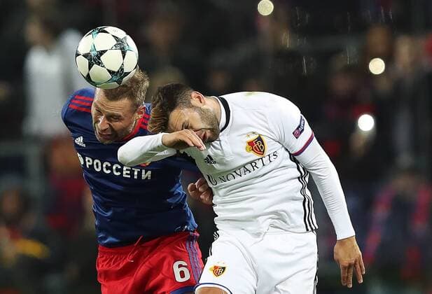 MOSCOW, RUSSIA - OCTOBER 18, 2017: CSKA Moscow s Alexei Berezutsky (L) and Basel s Renato Steffen iin their 2017 18 UEFA Champions League Group A Round 3 football match at VEB Arena; Basel won 2-0. Artyom Korotayev TASS  TS065579