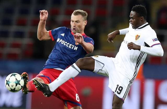 MOSCOW, RUSSIA - OCTOBER 18, 2017: CSKA Moscow s Alexei Berezutsky (L) and Basel s Dimitri Oberlin in their 2017 18 UEFA Champions League Group A Round 3 football match at VEB Arena; Basel won 2-0. Artyom Korotayev TASS  TS06557C