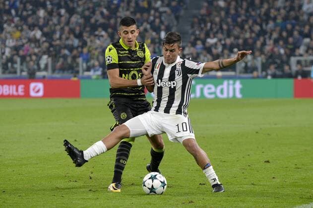 18th October 2017, Juventus Stadium, Turin, Italy; UEFA Champions League, Juventus versus Sporting Lisbon; Paulo Dybala shields the ball from Jonathan Silva  ActionPlus11941398