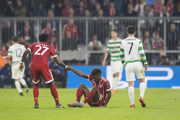 Football Champions League Encounter FC Bavaria Munich vs Celtic Glasgow Alliance Arena Munich 18 10 2017 in Picture David Alaba helps Kingsley Coman Patrick Roberts Â