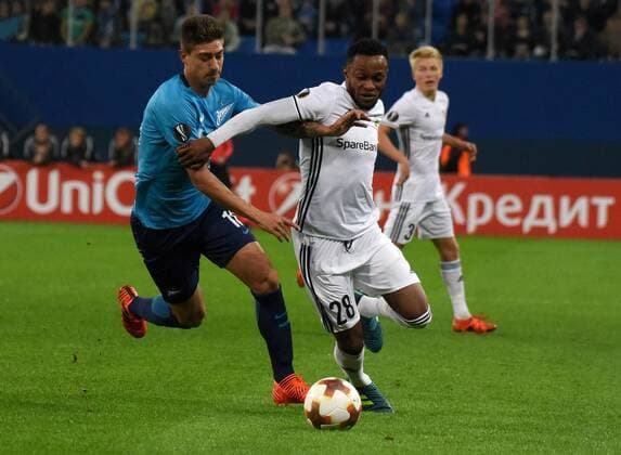 Russia. St. Petersburg. October 19, 2017. Zenit players Emiliano Rigoni and Rosenborg s Samuel Adegbenro (left to right) during the UEFA Europa League group stage match between Zenit (Russia, St. Petersburg) and Rosenborg (Norway, Trondheim).
