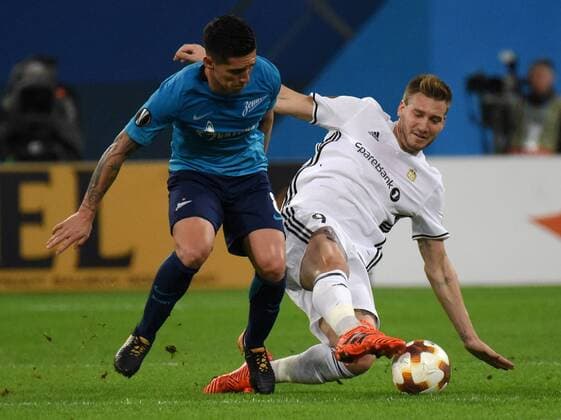 Russia. St. Petersburg. October 19, 2017. Zenit s Mathias Kranevitter and Rosenborg player Niklas Bendtner (left to right) during the UEFA Europa League group stage match between Zenit (Russia, St. Petersburg) and Rosenborg (Norway, Trondheim).