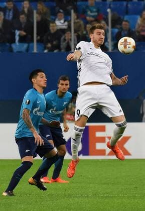 Russia. St. Petersburg. October 19, 2017. The players of Zenith Emiliano Rigoni; Emanuelle Mammann and Rusenborga Niklas Bendtner (left to right) in the group stage match of the UEFA Europa League between the teams Zenit (Russia, St. Petersburg) and Rosenborg (Norway, Trondheim).