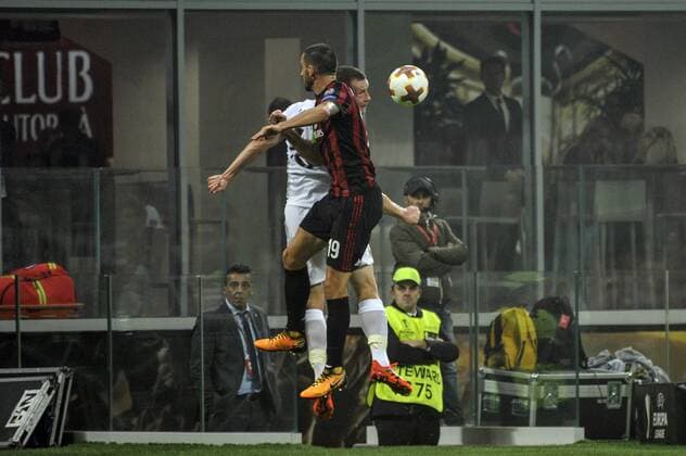 19th October 2017, San Siro, Milan, Italy; Leonardo Bonucci of Milan competes for the ball with Jakob Johansson of Aek Athens during the UEFA Europa League football, AC Milan versus AEK Athens;  ActionPlus11941552