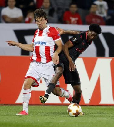 (171020) -- BELGRADE, Oct. 20, 2017 -- Crvena Zvezda s Filip Stojkovic (L) vies with Arsenal s Ainsley Maitland-Niles during UEFA Europa League match between Crvena Zvezda and Arsenal in Belgrade, Serbia on Oct 19. 2017. Arsenal won 1-0. ) (SP)SERBIA-BELGRADE-SOCCER-UEFA-EUROPA LEAGUE-CRVENA ZVEZDA VS ARSENAL PredragxMilosavljevic 