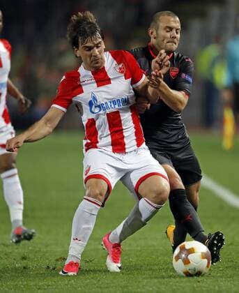 (171020) -- BELGRADE, Oct. 20, 2017 -- Crvena Zvezda s Filip Stojkovic (L) vies with Arsenal s Jack Wilshere during UEFA Europa League match between Crvena Zvezda and Arsenal in Belgrade, Serbia on Oct 19. 2017. Arsenal won 1-0. ) (SP)SERBIA-BELGRADE-SOCCER-UEFA-EUROPA LEAGUE-CRVENA ZVEZDA VS ARSENAL PredragxMilosavljevic 