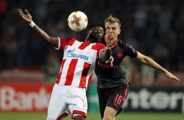 (171020) -- BELGRADE, Oct. 20, 2017 -- Richmond Boakye (L) vies with Arsenal s Rob Holding during UEFA Europa League match between Crvena Zvezda and Arsenal in Belgrade, Serbia on Oct 19. 2017. Arsenal won 1-0. ) (SP)SERBIA-BELGRADE-SOCCER-UEFA-EUROPA LEAGUE-CRVENA ZVEZDA VS ARSENAL PredragxMilosavljevic 