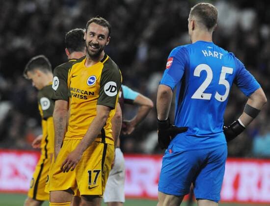 Football - 2017 2018 Premier League - West Ham United vs. Brighton & Hove Albion Glenn Murray of Brighton jokes with West ham goalkeeper, Joe Hart before scoring his second goal from the penalty spot at The London Stadium. COLORSPORT ANDREW COWIE 