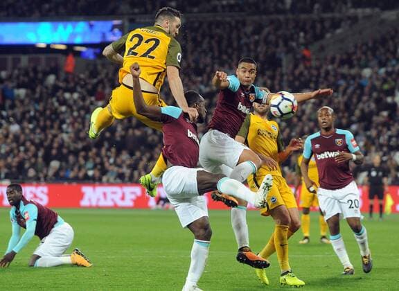 Football - 2017 2018 Premier League - West Ham United vs. Brighton & Hove Albion Shane Duffy of Brighton wins the header from Winston Reid at The London Stadium. COLORSPORT ANDREW COWIE 