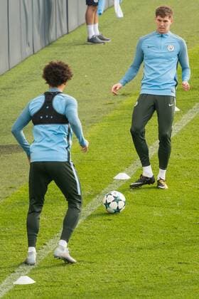 Manchester City Training John Stones (right) and Leroy San? of Manchester City during the Manchester City training session ahead of their Champions League match at City Football Academy, Manchester Content Not Available For UK Newspapers Copyright: xMattxWilkinsonx FIL-10884-0018