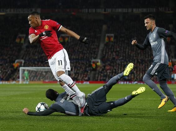 Anthony Martial of Manchester United ManU is brought down by Douglas of SL Benfica to earn a penalty during the Champions League Group A match at the Old Trafford Stadium, Manchester. Picture date: October 31st 2017. Picture credit should read: Andrew Yates Sportimage EDITORIAL USE ONLY. No use with unauthorised audio, video, data, fixture lists, club league logos or live services. Online in-match use limited to 120 images, no video emulation. No use in betting, games or single club league player publications.