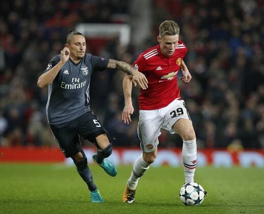 Ljubomir Fejsa of SL Benfica grabs Scott McTominay of Manchester United ManU during the Champions League Group A match at the Old Trafford Stadium, Manchester. Picture date: October 31st 2017. Picture credit should read: Andrew Yates Sportimage EDITORIAL USE ONLY. No use with unauthorised audio, video, data, fixture lists, club league logos or live services. Online in-match use limited to 120 images, no video emulation. No use in betting, games or single club league player publications.