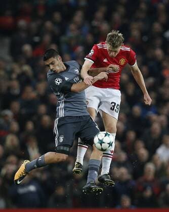 Scott McTominay of Manchester United ManU tussles with Raul Jimenez of SL Benfica during the Champions League Group A match at the Old Trafford Stadium, Manchester. Picture date: October 31st 2017. Picture credit should read: Andrew Yates Sportimage EDITORIAL USE ONLY. No use with unauthorised audio, video, data, fixture lists, club league logos or live services. Online in-match use limited to 120 images, no video emulation. No use in betting, games or single club league player publications.