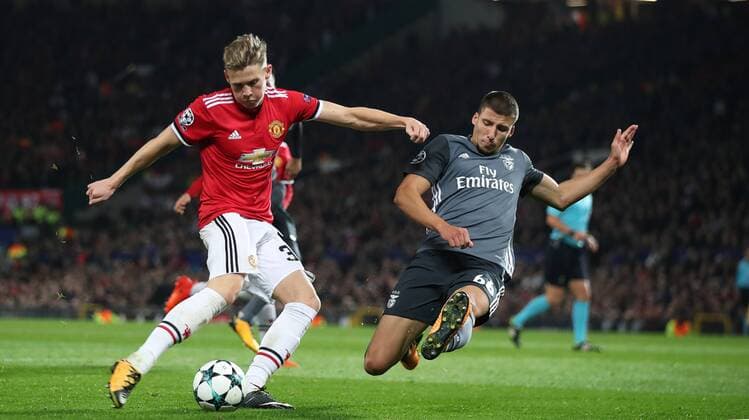 Football - 2017 2018 UEFA Champions League - Group A: Manchester United ManU vs. S.L. Benfica Ruben Dias of Benfica and Scott McTominay of Manchester United at Old Trafford COLORSPORT LYNNE CAMERON 