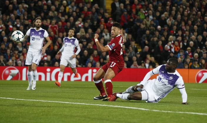 Jean-Claude Billong of NK Maribor tackles Alex Oxlade-Chamberlain of Liverpool during the Champions League Group E match at Anfield Stadium, Liverpool. Picture date: November 1st 2017. Picture credit should read: Andrew Yates Sportimage EDITORIAL USE ONLY. No use with unauthorised audio, video, data, fixture lists, club league logos or live services. Online in-match use limited to 120 images, no video emulation. No use in betting, games or single club league player publications.