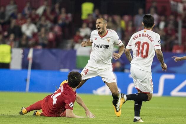 November 1, 2017 - Seville, Spain - Guido Pizarro of Sevilla (C ) receives a foul from Georgi Dzhikiya of Spartak during the UEFA Champions League Group E soccer match between Sevilla FC and Spartak Moskva at Estadio Ramon Sanchez Pizjuan Soccer 2017 - Sevilla FC vs Spartak Moskva - ZUMAa142 20171101_zap_a142_005 Copyright: xDanielxGonzalezxAcunax