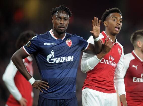 Football - 2017 2018 UEFA Europa League - Group H: Arsenal vs. Red Star Belgrade (Crvena zvezda) Richmond Boakye of Red Star and Joseph Willock of Arsenal, at The Emirates. COLORSPORT ANDREW COWIE 