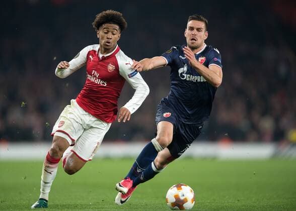 Reiss Nelson of Arsenal battles with Marko Gobeljic of Red Star Belgrade during the UEFA Europa League group H match between Arsenal and Red Star Belgrade at the Emirates Stadium, London, England on 2 November 2017. Copyright: xVincexMignottx 17500023