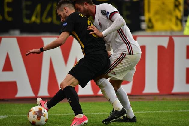 Italy: AEK versus Milan Helder Lopes (no 3) of AEK, protect the ball from the attack of Mateo Musacchio (no 22) of Milan. Athens Attiki Greece OAKA Spiros Louis  DimitriosxKarvountzisx xPacificxPress