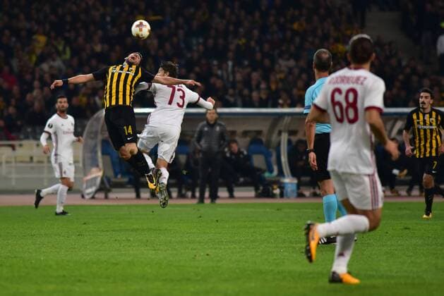 Italy: AEK versus Milan Tasos Bakasetas (no 14) of AEK vies for the ball with Alessio Romagnoli (no 13) of Milan. Athens Attiki Greece OAKA Spiros Louis  DimitriosxKarvountzisx xPacificxPress
