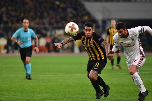 Italy: AEK versus Milan Sergio Araujo (no 11) of AEK and Mateo Musacchio (no 22) of Milan vies for the ball. Athens Attiki Greece OAKA Spiros Louis  DimitriosxKarvountzisx xPacificxPress
