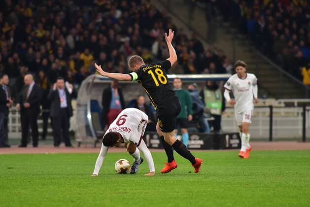 Italy: AEK versus Milan Andre Silva (no 9) of Milan protect the ball despite the pressure by Jakob Johansson (no 18) of AEK. Athens Attiki Greece OAKA Spiros Louis  DimitriosxKarvountzisx xPacificxPress
